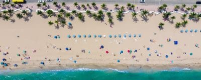 aerial photography of coastline with people